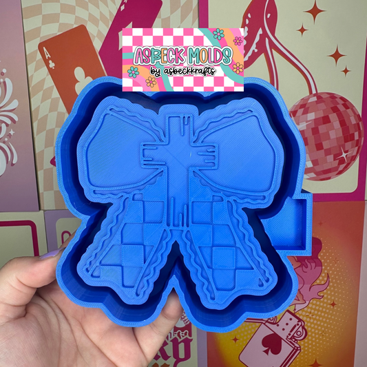 Checkered cross with bow